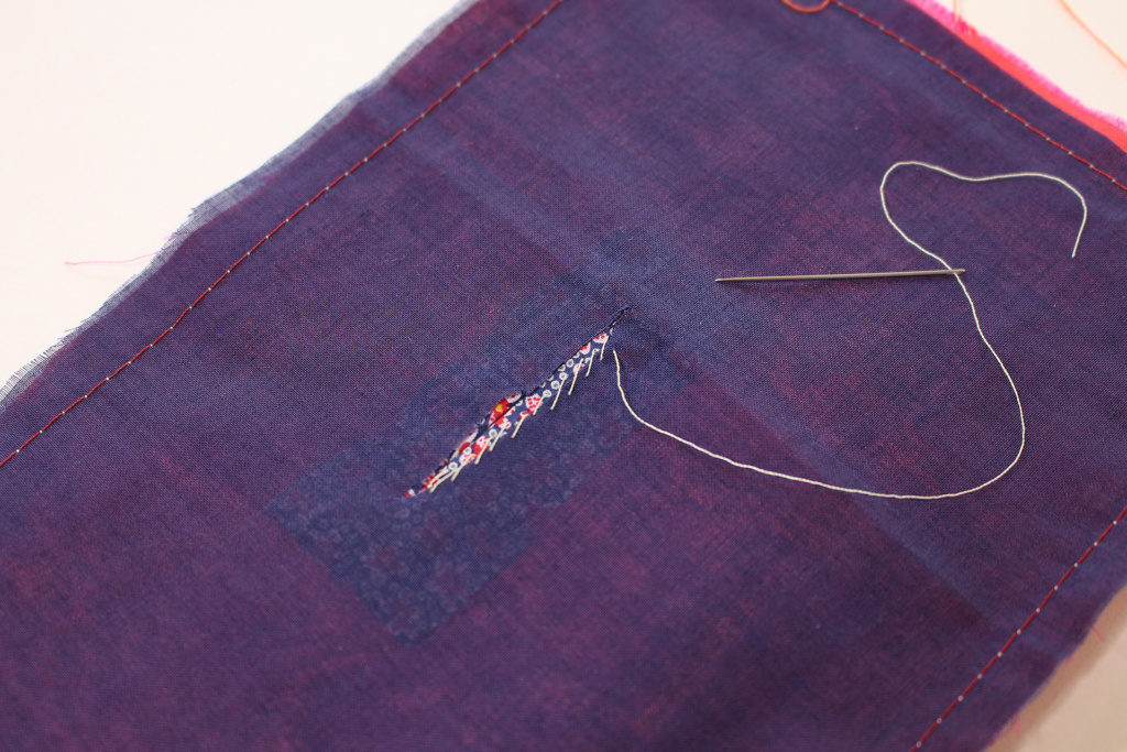 Back of bound buttonhole, specifically sewing the stitching attaching the lining or facing. | Vintage on Tap